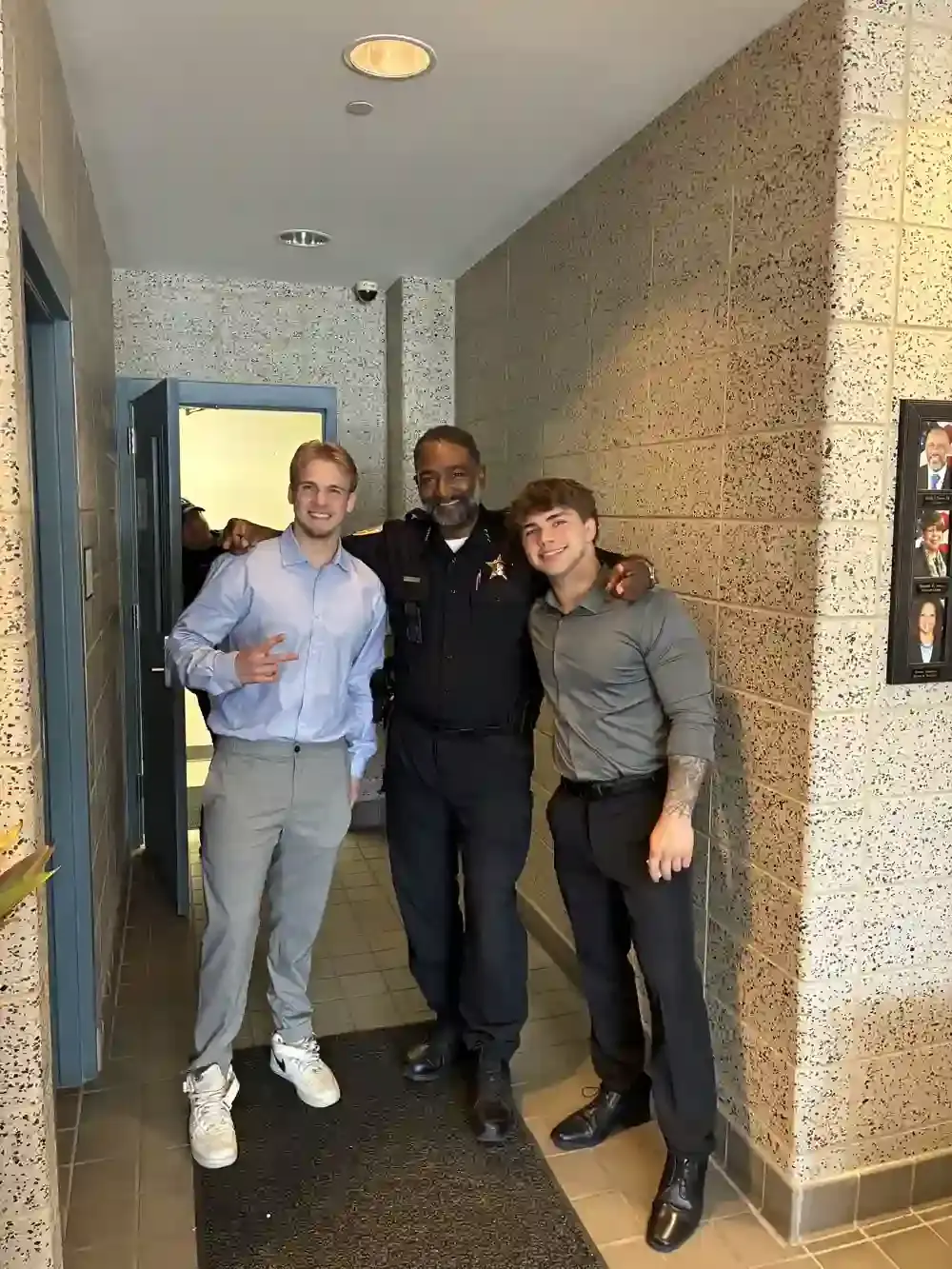 Marco and Taras with a local sheriff at a first-responder outreach event