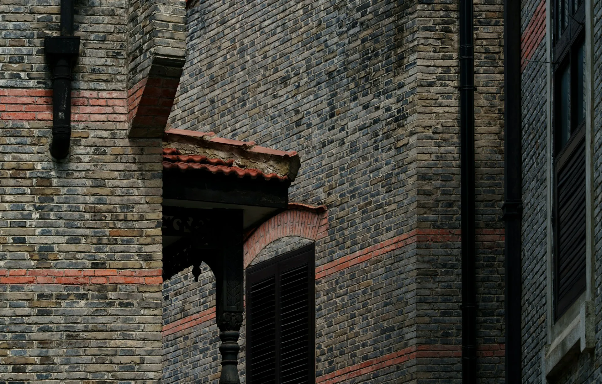 The brick frontage of a small business on a side street.