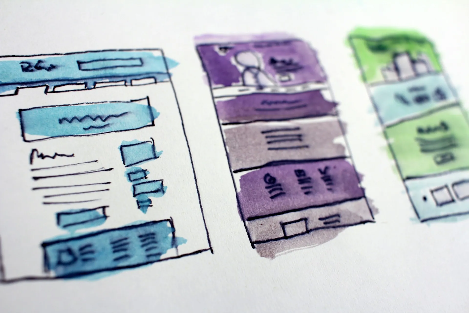 Hand-drawn layout sketches spread across a desk.