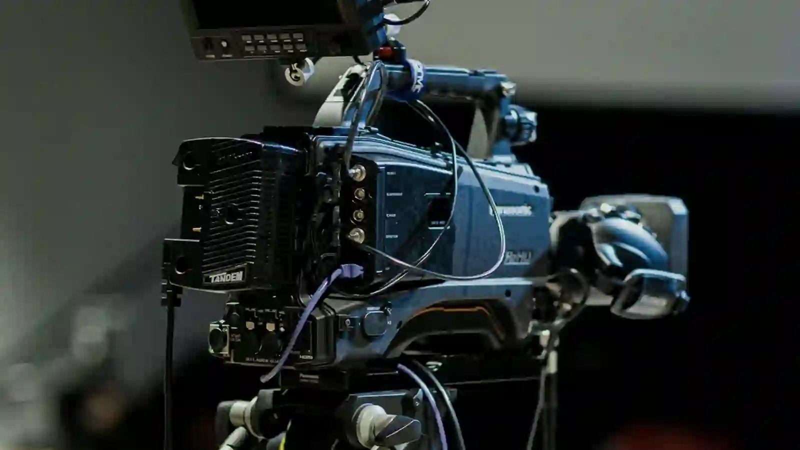 A cinema camera rigged and ready on set.