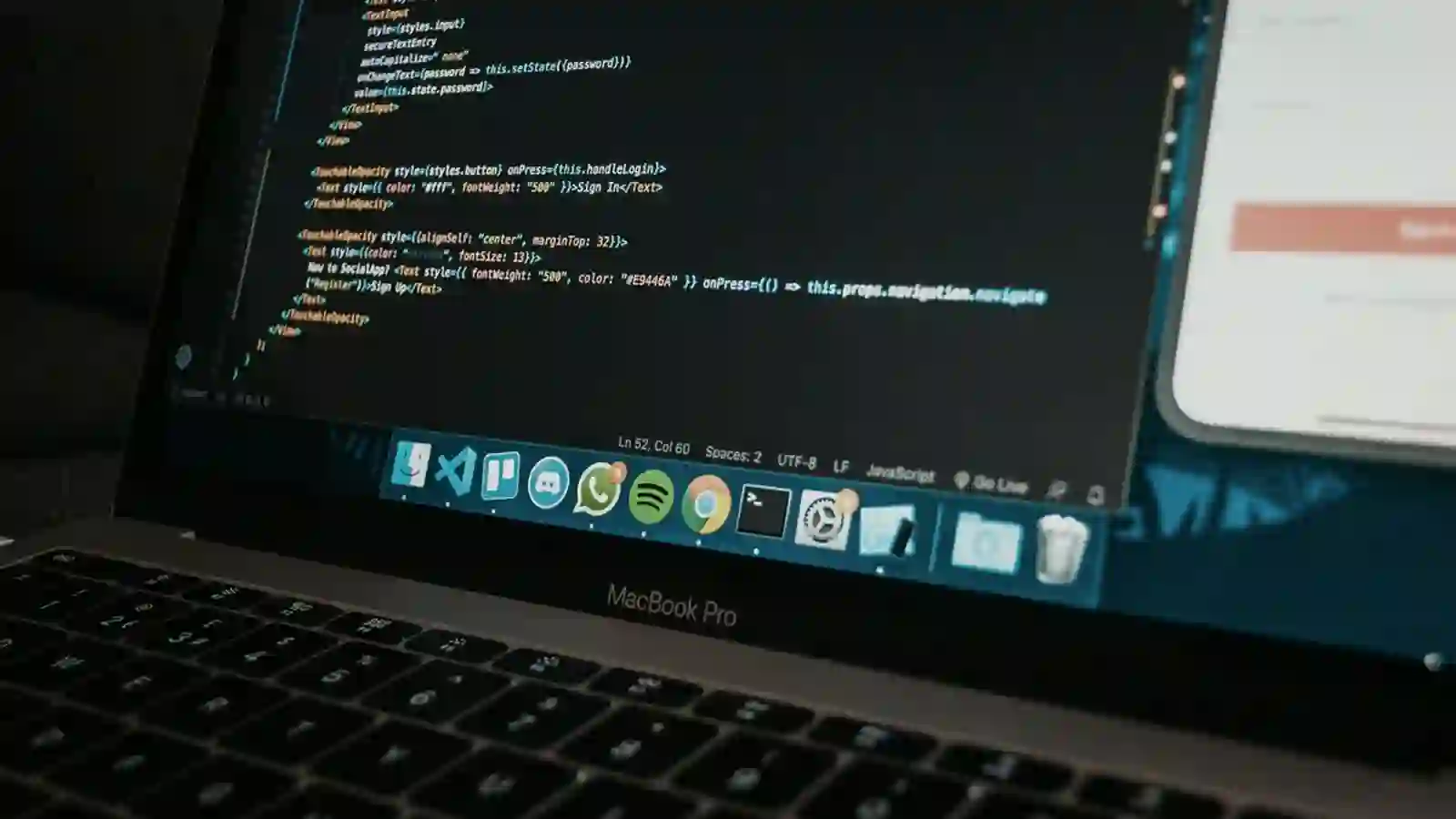 A site under construction on a laptop screen.
